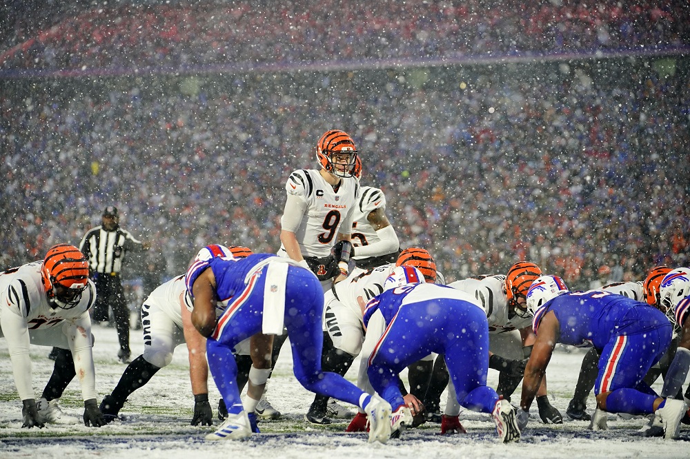 NFL playoffs: Joe Burrow, Bengals plow past Bills in snowy AFC