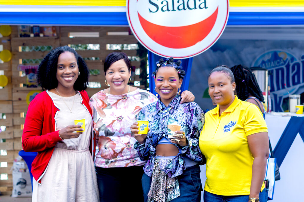 Recording artiste and dancer Amanyea (second from right) engages in conversation over a cup of coffee with Salada Foods team members, including Tamii Brown, General Manager, Kerrian Johnson, Commercial and Corporate Affairs Manager, and Kerrine Tulloch, Marketing Coordinator, during the Jamaica Blue Mountain Coffee Festival at the Newcastle Parade Grounds. (Photo: Contributed)
