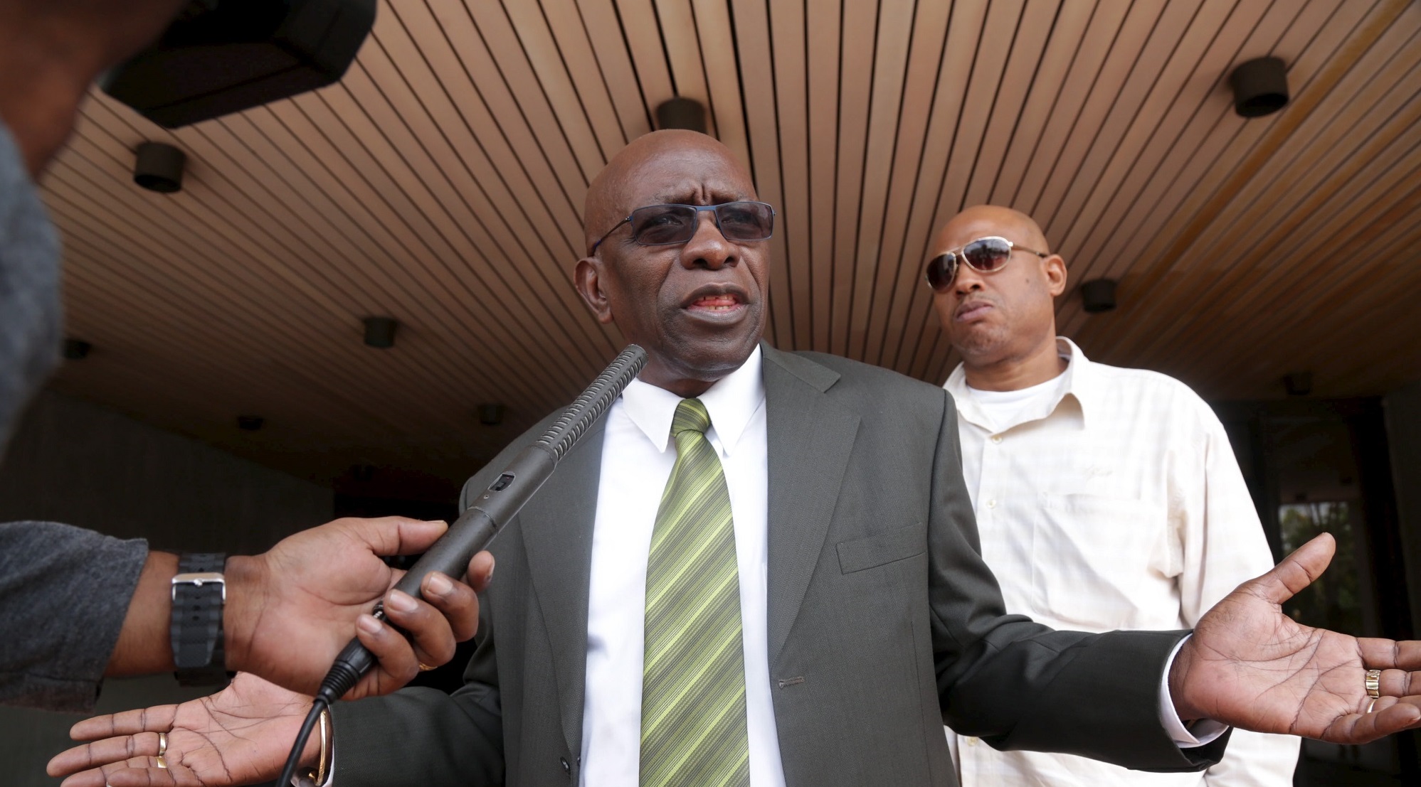 FILE PHOTO: Warner talks to the media outside Hall of Justice in the capital Port-of-Spain