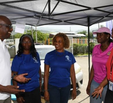 Paulton Gordon at UTech Health Fair with event Sponsors