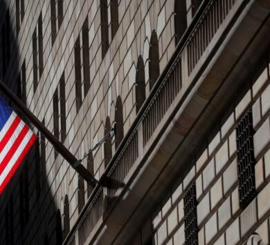 FILE PHOTO: A U.S. flag flies outside The Federal Reserve Bank of New York in New York