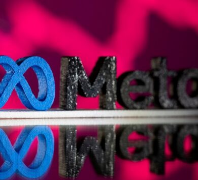 FILE PHOTO: A 3D printed Facebook’s new rebrand logo Meta is seen in front of displayed stock graph in this illustration